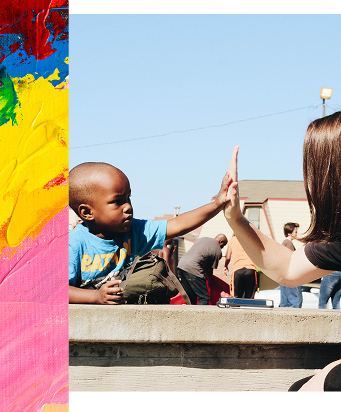 Small boy high-fiving woman Small boy high-fiving woman
